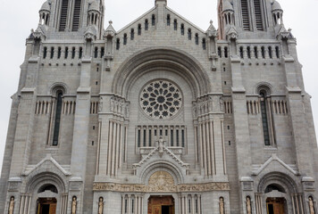 Fototapeta premium Majestic entrance of Basilica of Sainte-Anne-de-Beaupre, Cathedral, Quebec an important Catholic sanctuary, which receives about a half-million pilgrims each year. 