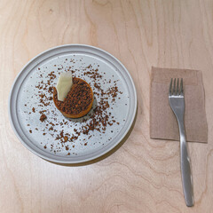 Thai tea rare cheesecake on white plate