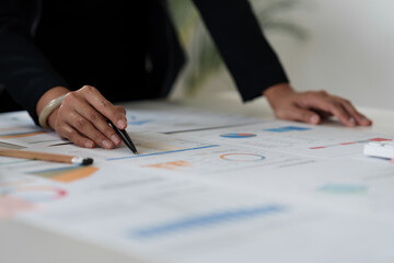 Close up Business woman hand using calculator to calculate the company's financial results and budget. Account Audit Concept.