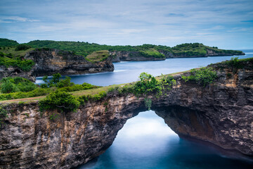 Fototapeta premium Stone arch over the sea, Broken Beach, Nusa Penida, Bali, Indonesia