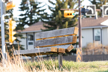 Park bench beside city street