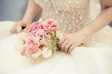 Bride holding the wedding bouquet, Detail image cut