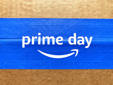 Amazon Prime Day sign, logo on blue tape of cardboard box advertises annual deal event exclusively for Amazon.com Prime members - Seattle, Washington, USA - 2023