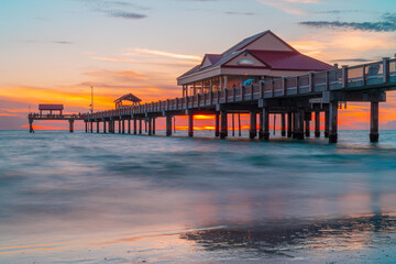 Sunset. Clearwater Beach Florida. Pier 60 Clearwater Beach FL. Beautiful seascape. Fishing pier. Summer vacations. Ocean or Gulf of Mexico. Florida paradise. Tropical nature. Good for travel agency.
