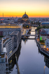 Sunset at the river Spree in Berlin with the cathedral in the back