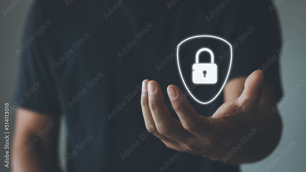Poster businessman holding shield with lock protect security icon security on the virtual display. cyber se