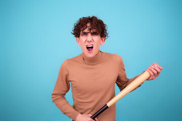 Young attractive guy with a bat.	