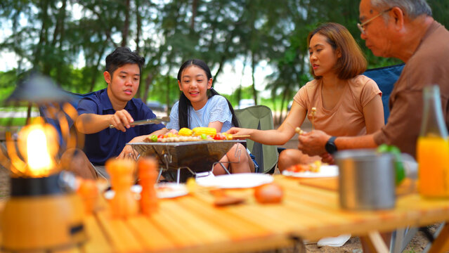 Happy Family Preparing Barbecue Together, Cooking Grilled Bbq Dinner Outside Beach, Enjoy Summer On The Beach Enjoy On Weekend People Lifestyle.