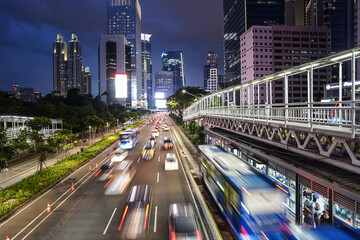 Jakarta, Indonesia: Traffic captured with blurred motion rushes on the Jakarta business district at...