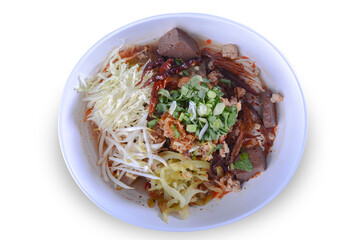 Rice noodles with spicy pork sauce.Local food of Thai in the north of Thailand.The main ingredients include rice noodles,pork blood,pork,tomatoes.Food that is eaten with fresh vegetables. 
