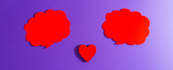 Red clouds,heart for Valentine's day concept.Communication red heart between two clouds. Purple,veri peri background.Place for your text. Copy space.Banner.