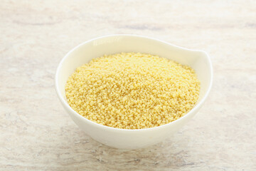 Raw couscous in the bowl