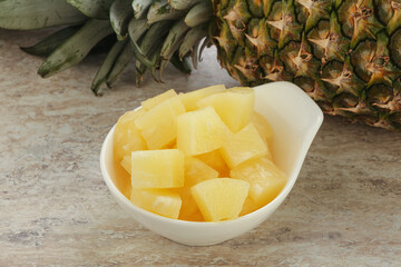 Marinated pineapple slices in the bowl
