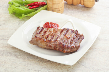 Grilled rib-eye steak beef meat