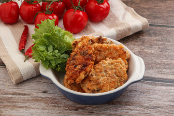 Fried salmonn cutlet in the bowl