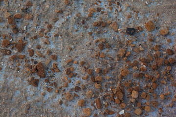 Texture of the dried earth. Background with brown stones and sand. Drought and lack of moisture in...