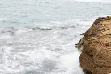 waves crashing on rocks