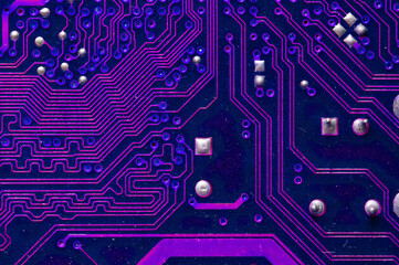 Printed neon purple circuit board. Electronic computer technology. Motherboard digital chip....