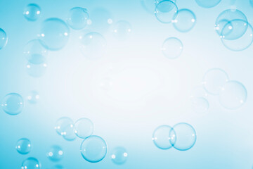 Fototapeta na wymiar Abstract Beautiful Transparent Blue Soap Bubbles with A White Space. Soap Sud Bubbles Water 