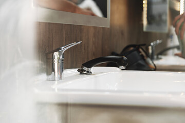 Workplace with a washbasin in barbershop close up
