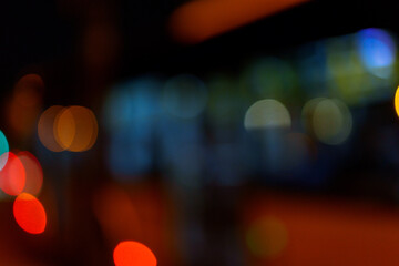 Bokeh traffic light at night in the street of a big city for background