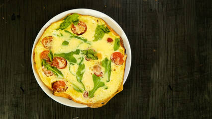 omelet with tomatoes and herbs fried eggs delicious healthy breakfast in rustic style