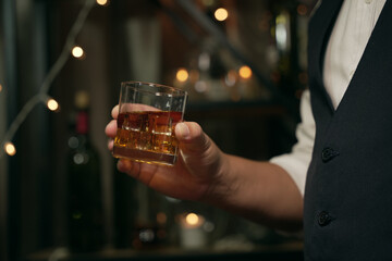 Barman pouring whiskey whiskey glass beautiful night