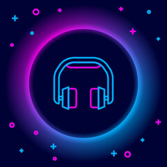 Glowing neon line Headphones icon isolated on black background. Earphones. Concept for listening to music, service, communication and operator. Colorful outline concept. Vector