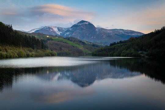 Ibiur reservoir with Txindoki mountain as background, Basque Country in Spain
