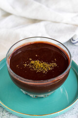 Supangle dessert or sup dessert on stone background. Chocolate pudding with cream filling in the middle. World cuisine delicacies. close up