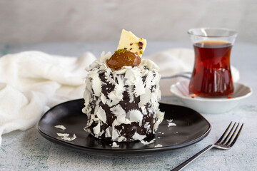 Chestnut cake. Small celebration cake with chestnut inside on a white background. close up