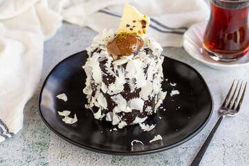 Chestnut cake. Small celebration cake with chestnut inside on a white background. close up