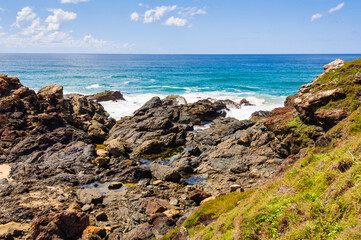 Fototapeta na wymiar Rocky shore at the Tacking Point Lighthouse - Port Macquarie, NSW, Australia