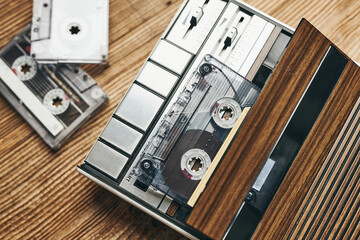 Compact cassette tapes and cassette recorder. Retro music style. 80s music party. Vintage style. Analog equipment. Stereo sound. Back to the past - obrazy, fototapety, plakaty
