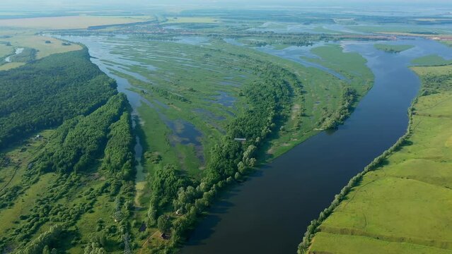 Picturesque views from the air and drone nature of Tatarstan and Russia. Sviyaga River. The river sprouts vegetation. Quiet ples stretch. Panorama for travel and tourism. Berry fields. From above. 