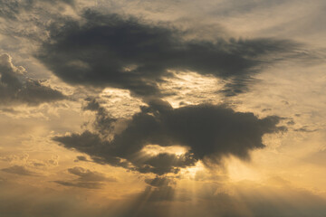Clouds block the sun at sunset in the form of a human face