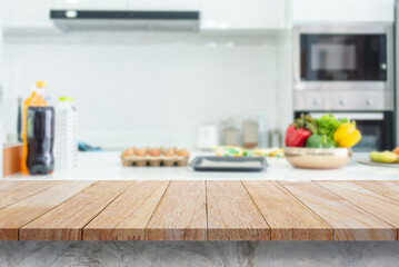 Wooden table top on blurred kitchen background For editing product displays or designing main image layouts, copy space for text.