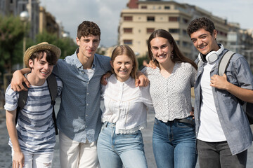 Fototapeta premium Group of teenagers posing and smiling to camera together. Friendship concept.