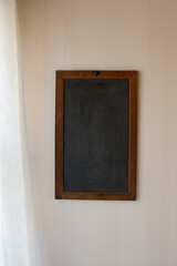 Empty blackboard on wall
