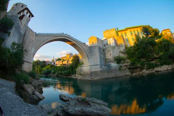 Papier Peint photo Stari Most Historical Stari Most bridge over Neretva river in Mostar Old town, Balkan mountains, Bosnia and Herzegovina