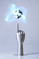 Mechanical robot arm or hand interacts with futuristic digital technologies.