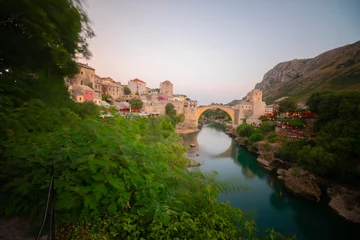Photo sur Plexiglas Stari Most Historical Stari Most bridge over Neretva river in Mostar Old town, Balkan mountains, Bosnia and Herzegovina