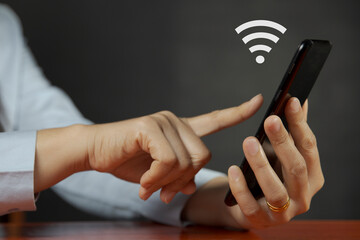 woman with phone in hand Looking for a free Wi-Fi internet signal?