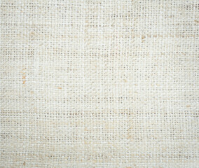 Jute hessian sackcloth burlap canvas woven texture background pattern in light beige cream brown color design element.
