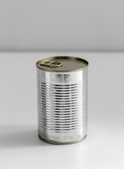 food storage and eating concept - close up of tin can with preserve on table