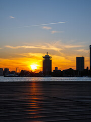 Obraz premium Sunset in Amsterdam with skyline and buildings