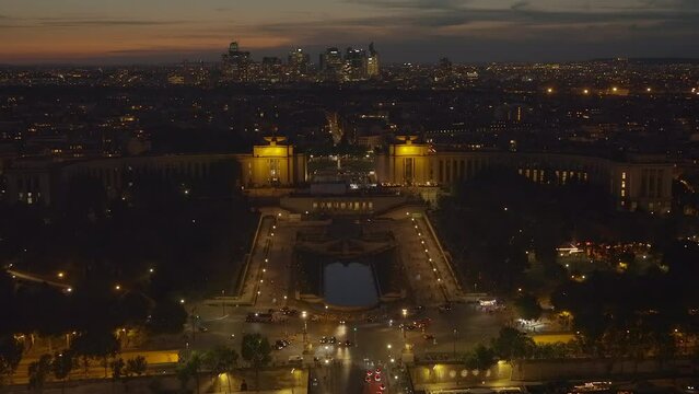 Trocadero esplanade and La Defense district seen from the Eiffel Tower at night in Paris, France