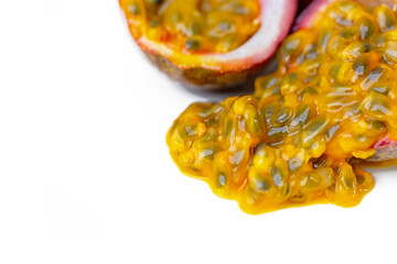 passion fruit with flesh and seeds on white background