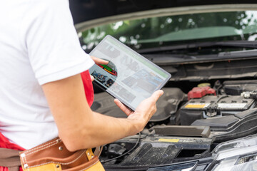 car service, repair, technology, maintenance and people concept - mechanic man with tablet pc computer making system diagnostic at workshop