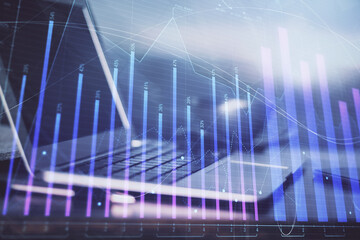 Forex market chart hologram and personal computer background. Double exposure. Concept of investment.